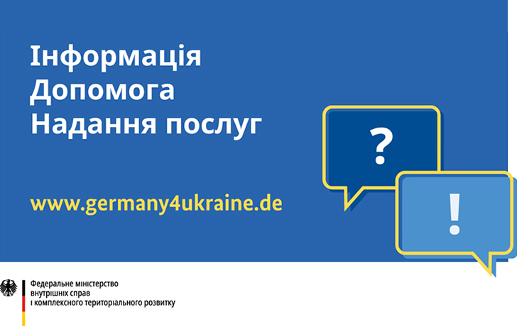 Werbebanner in Ukrainisch: weiße und gelbe Schrift auf blauem Grund